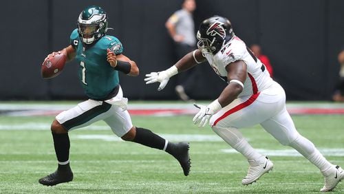 Falcons defensive lineman Grady Jarrett runs Philadelphia Eagles quarterback Jalen Hurts out of bounds on a 4th-and-4 attempt to turn it over on downs during the second quarter Sunday, Sept. 12, 2021, at Mercedes-Benz Stadium in Atlanta. (Curtis Compton / Curtis.Compton@ajc.com)