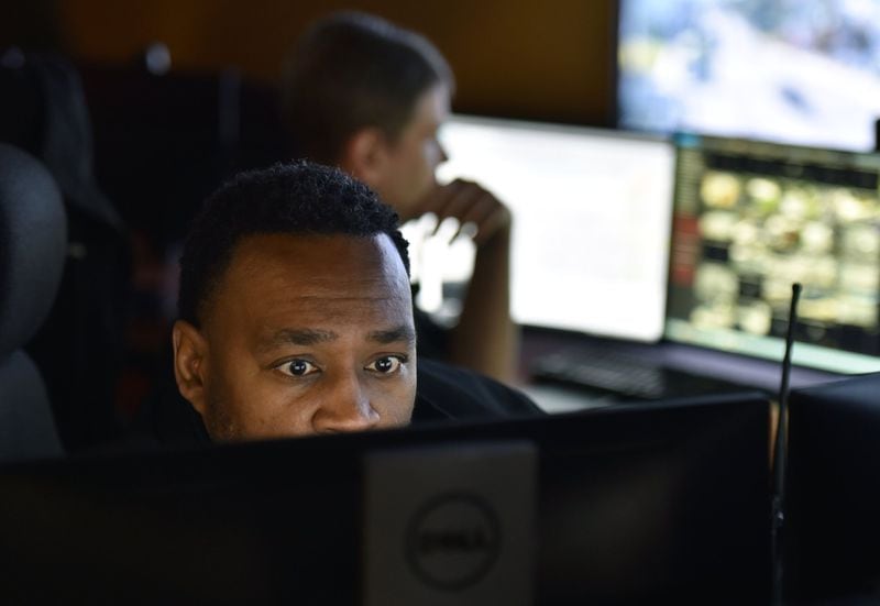October 22, 2019 Atlanta - APD officers Antwoin Williams (foreground) and Charles Schiffbauer monitor surveillance cameras at Loudermilk Video Integration Center in Atlanta on Tuesday, October 22, 2019. If you’re in Atlanta, you’re probably on camera. Data from tech research firm Comparitech finds roughly 15 security cameras for every 1,000 residents, making us the only U.S. city to crack the top 10 in a study of the world’s most surveilled places. (Hyosub Shin / Hyosub.Shin@ajc.com)