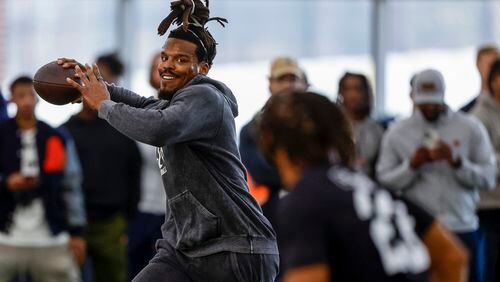 Former NFL and Auburn quarterback, Cam Newton, throws a pass during Auburn Pro Day, Tuesday, March 21, 2023, in Auburn, Ala. (AP Photo/Butch Dill)