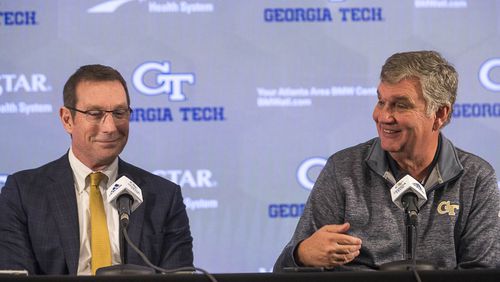 Georgia Tech Athletic Director Todd Stansbury (left) and football head coach Paul Johnson speak during a press conference Thursday, Nov. 29, 2018, in Atlanta addressing Johnson's decision to step down as head coach.