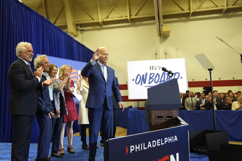 President Joe Biden, from right, joined by members of the Kennedy family, waves to the audience at a campaign event, Thursday, April 18, 2024, in Philadelphia. Pictured from left are Maxwell Kennedy Sr., Joe Kennedy III and Kathleen Kennedy Townsend. (AP Photo/Alex Brandon)