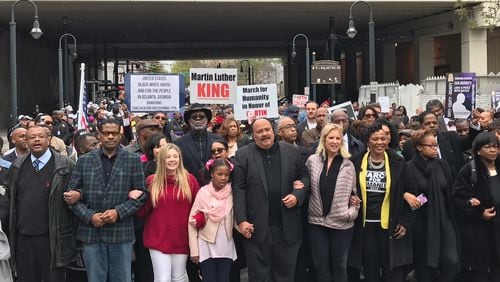Martin Luther King III, center, holding hands with his daughter Yolanda Renee King, and his sister Bernice King (third from right) lead the March for Humanity Monday commemorating the funeral procession for his father.  Next to Yolanda Renee, in the red sweater, is Jaclyn Corin, an organizer of March for Our Lives. Kerry Kennedy, daughter of Robert Kennedy, walks between King III and Bernice King.  Rosalind Bentley / rbentley@ajc.com