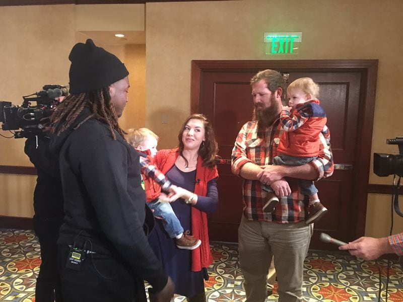 Shaquem Griffin, a linebacker for UCF, meets Amanda and Matthew Davis on Wednesday. Amanda is holding Jordan Davis and Matthew is holding John. Griffin and Jordan Davis were each affected by Amniotic Band Syndrome before they were born.
