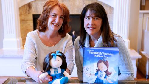 Last year, Julie Anne Cooper and Wendy Brant featured Hanukkah in the first of five books for ages four and above highlighting customs and culture. The other books will feature Kwanza, Diwali, Christmas, and Halloween. Miguel Martinez / miguel.martinezjimenez@ajc.com
