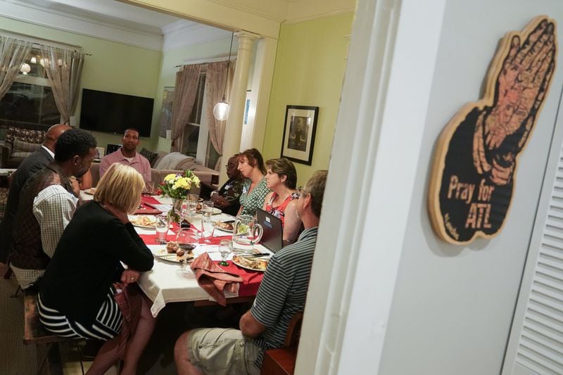 People participate in a dinner conversation on race as part of Decatur Dinners at the home of Clare and Jay Schexnyder on Sunday, Aug. 25, 2019, in Decatur. The dinner was one of 100 being held simultaneously across Decatur to talk about race and equity. (Elijah Nouvelage for The Atlanta Journal0Constitution)
