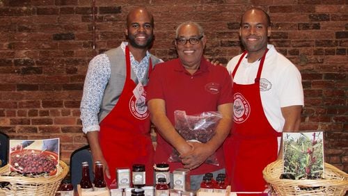 Yasin Muhaimin (center) and his sons Yasin I. Muhaimin (left) and Najeeb Muhaimin, took their Pride Road hibiscus jelly to the 2018 Flavor of Georgia competition, where it was a finalist. CONTRIBUTED BY PRIDE ROAD