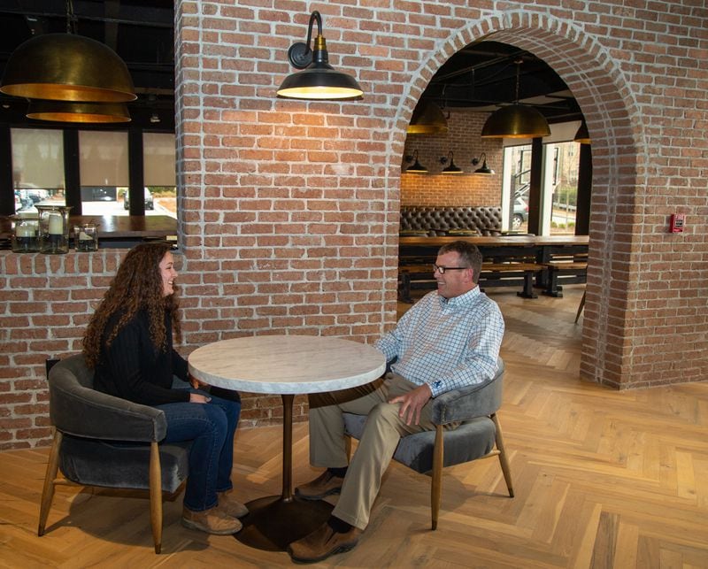 Ellie Jones & Kenneth Underwood chat in a common area at the Brasfield & Gorrie headquarters in Atlanta. For the Top Workplace Large company category. Jones has been with the company for 2.5 years while Underwood for 33 years. PHIL SKINNER FOR THE ATLANTA JOURNAL-CONSTITUTION.