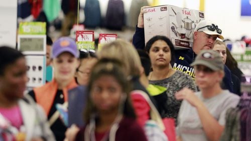 November 25, 2016 - East Cobb - Black Friday shoppers wait to check out at Kohl’s in East Cobb. Kohl’s was among retailers opening Thursday evening and staying open until midnight Friday, nearly 30 hours later. BOB ANDRES /BANDRES@AJC.COM