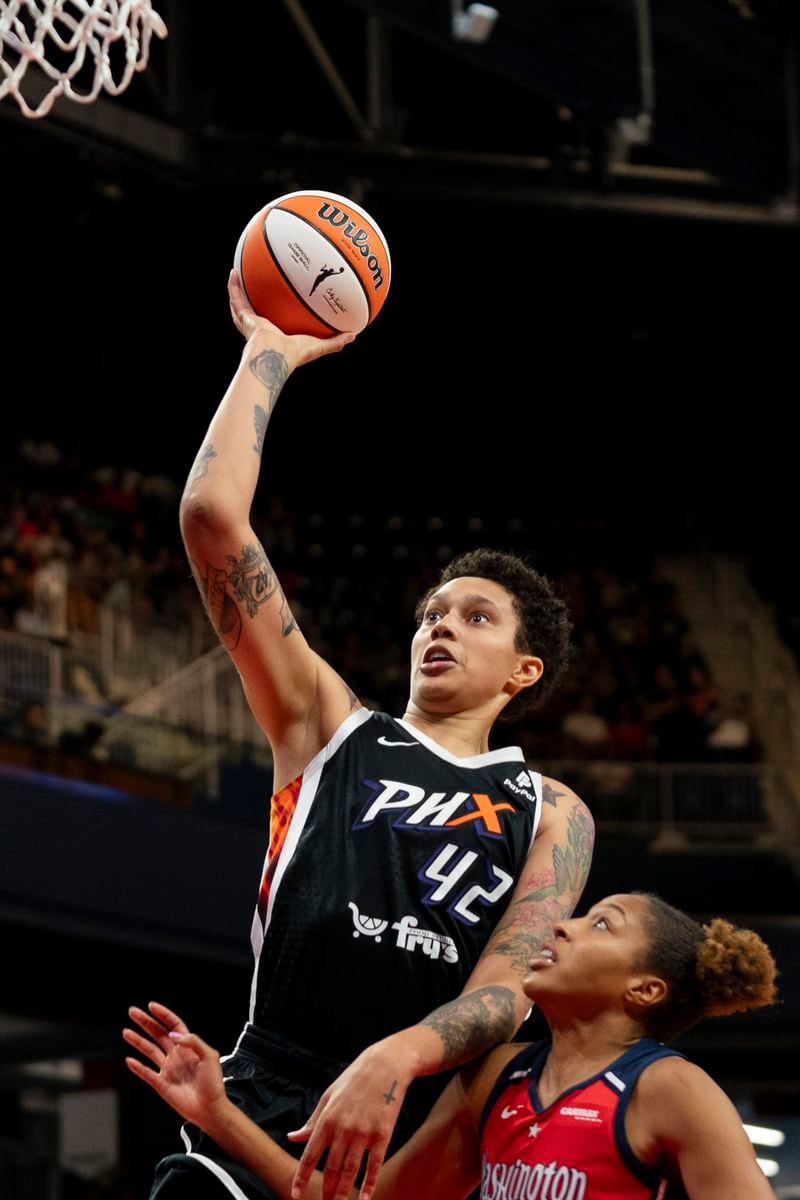 FILE - Phoenix Mercury center Brittney Griner (42) makes a layup during the second quarter of a WNBA basketball game against the Washington Mystics, Sunday, July 23, 2023, in Washington. A’ja Wilson, Breanna Stewart and Brittney Griner will be back on the courts chasing another WNBA title when camps open on Sunday, April 28. (AP Photo/Stephanie Scarbrough, File)