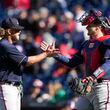 Atlanta Braves relief pitcher A.J. Minter, left, and catcher Sean Murphy high-five after closing out an opening day baseball game against the Washington Nationals at Nationals Park, Thursday, March 30, 2023, in Washington. Atlanta won 7-2. (AP Photo/Alex Brandon)