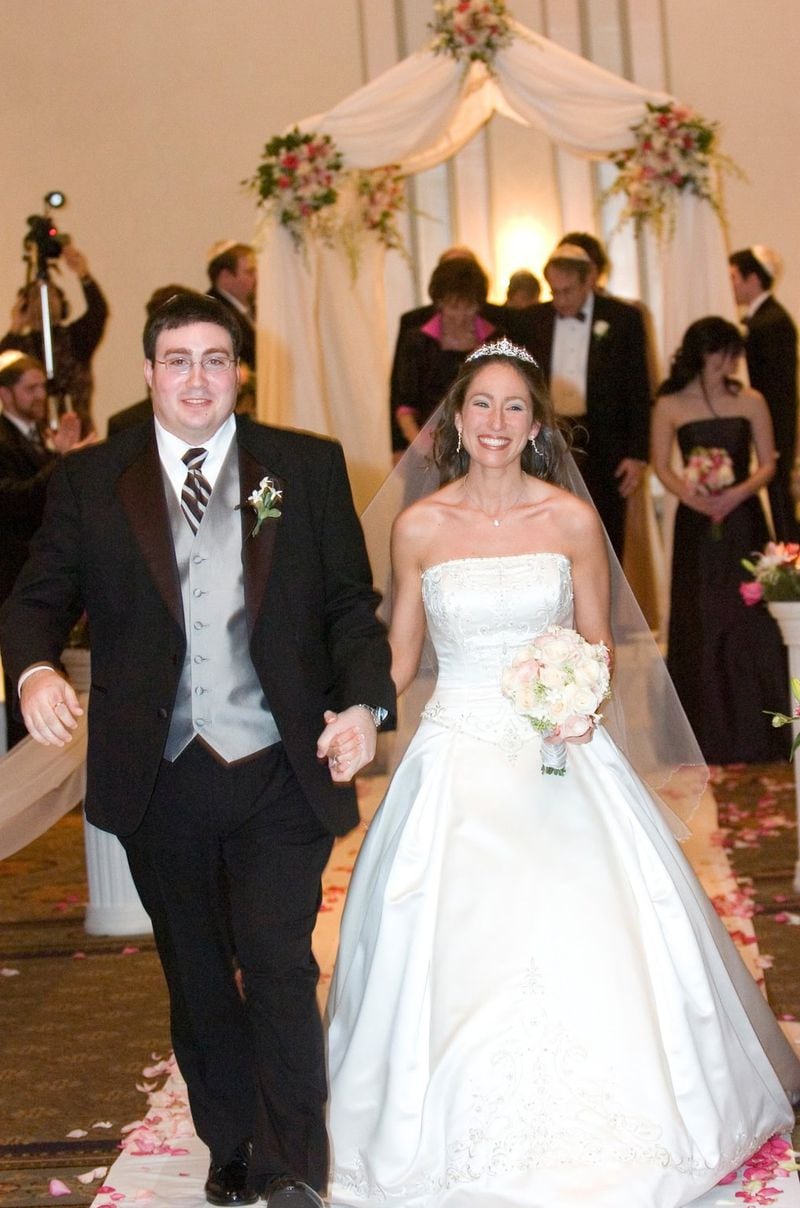 Kurt and Emily Moore on their wedding day in 2006. The couple met during their freshman year at the University of Alabama. CONTRIBUTED