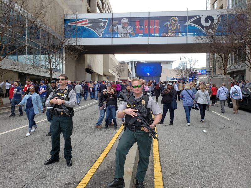 Some folks have to work, and carry semi-automatic weapons, on Super Bowl Sunday.
