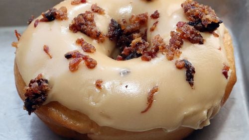 SEPTEMBER 13, 2013-DECATUR: Photo of a Bacon & Salty Caramel doughnut from Maria Moore Riggs' Revolution Doughnuts in Decatur on Friday September 13th, 2013. For story on the fancy doughnut craze. PHIL SKINNER / PSKINNER@AJC.COM