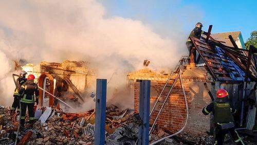 In this photo provided by the Ukrainian Emergency Service, rescuers work at a damaged building after a Russian missile attack in Kyiv region, Ukraine, Wednesday, May 8, 2024. (Ukrainian Emergency Service via AP Photo)
