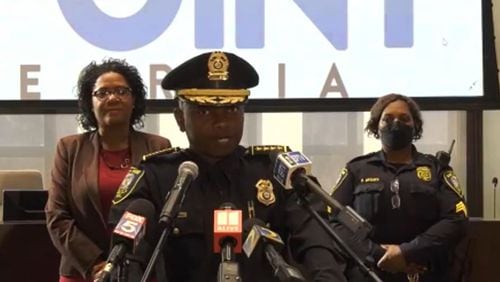 East Point police Chief Shawn Buchanan (center) assured citizens that concrete steps were being taken to combat crime, including every officer going on patrol, regardless of rank.