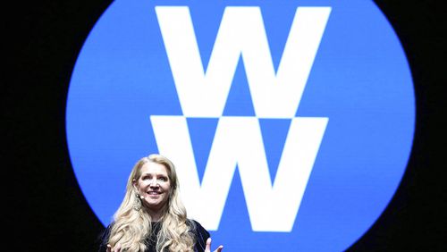 Weight Watchers President and Chief Executive Officer Mindy Grossman speaks at a global employee event in New York. Weight Watchers says it is renaming itself to WW to focus more on overall wellness and not just dieting. (Amy Sussman/AP Images for Weight Watchers, File)