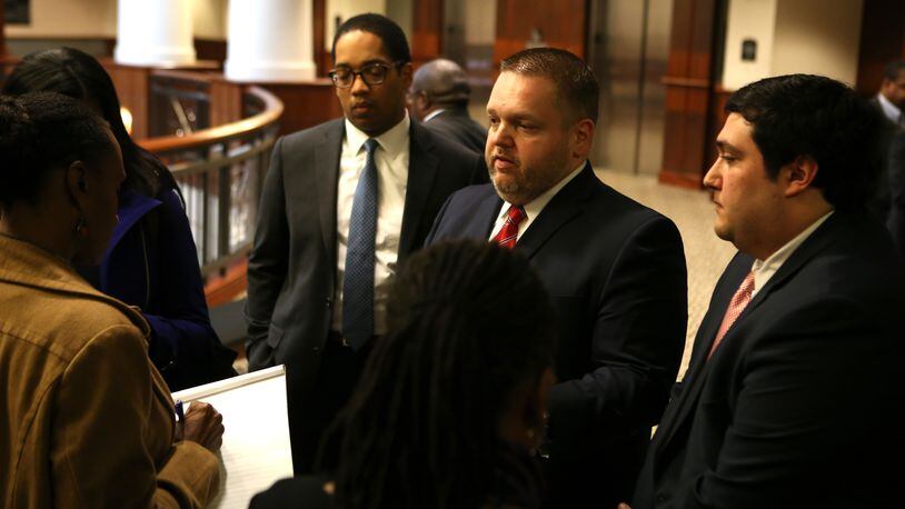 District Attorney Brian Fortner (center) outside a Douglas County courtroom in 2017. HENRY TAYLOR / HENRY.TAYLOR@AJC.COM