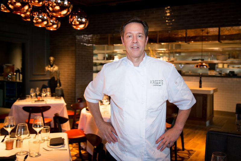  Chef Peter Kaiser in the dining room at Kaiser’s Chophouse in Sandy Springs. Photo credit- Mia Yakel.
