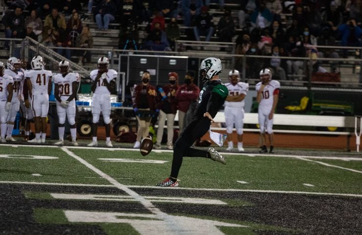 Caden Long, senior kicker for Roswell, punts the ball during the Mill Creek vs. Roswell high school football game on Friday, November 27, 2020, at Roswell High School in Roswell, Georgia. Mill Creek led Roswell 27-21 at the end of the third quarter. CHRISTINA MATACOTTA FOR THE ATLANTA JOURNAL-CONSTITUTION