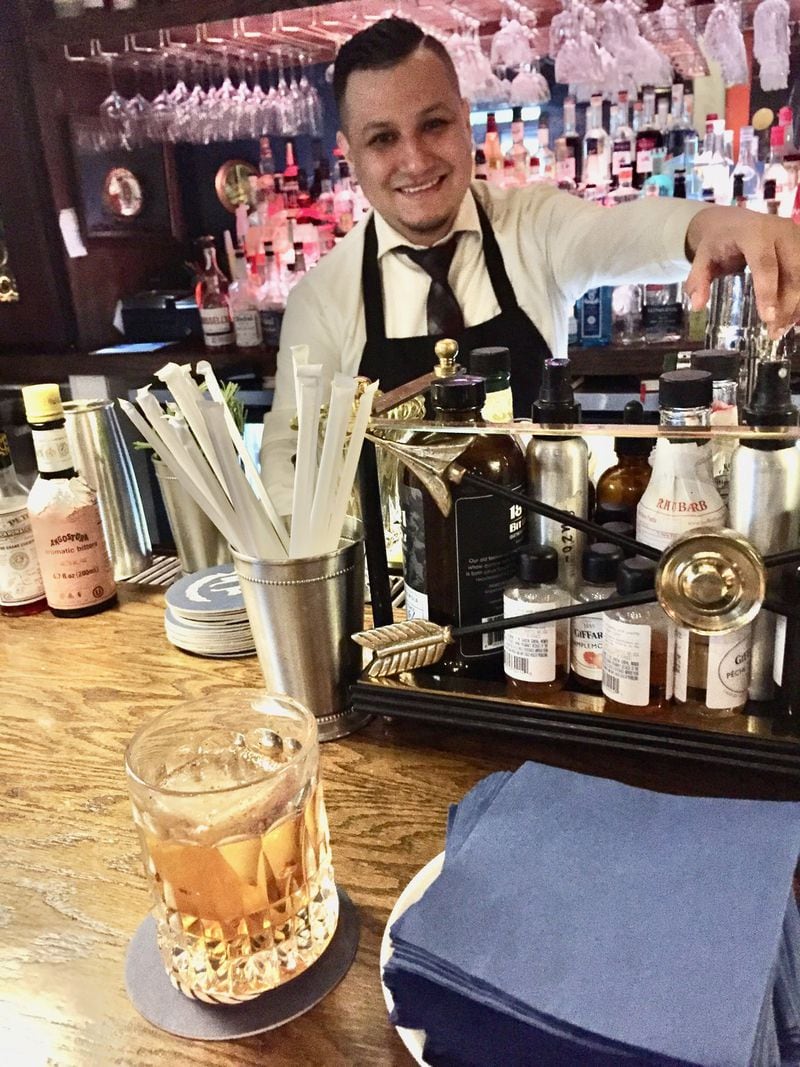 At The Consulate, bartender Giovanni Ramirez created the Goldfinger, only available on the happy hour menu. Contributed by Suzanne Van Atten