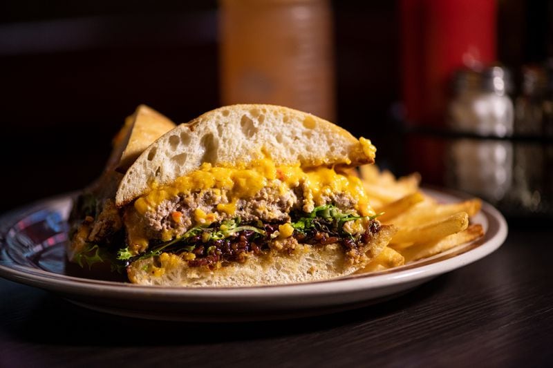 Wonderkid Meatloaf Melt with beef and pork, pimento cheese, bacon jam, fancy greens and ciabatta.