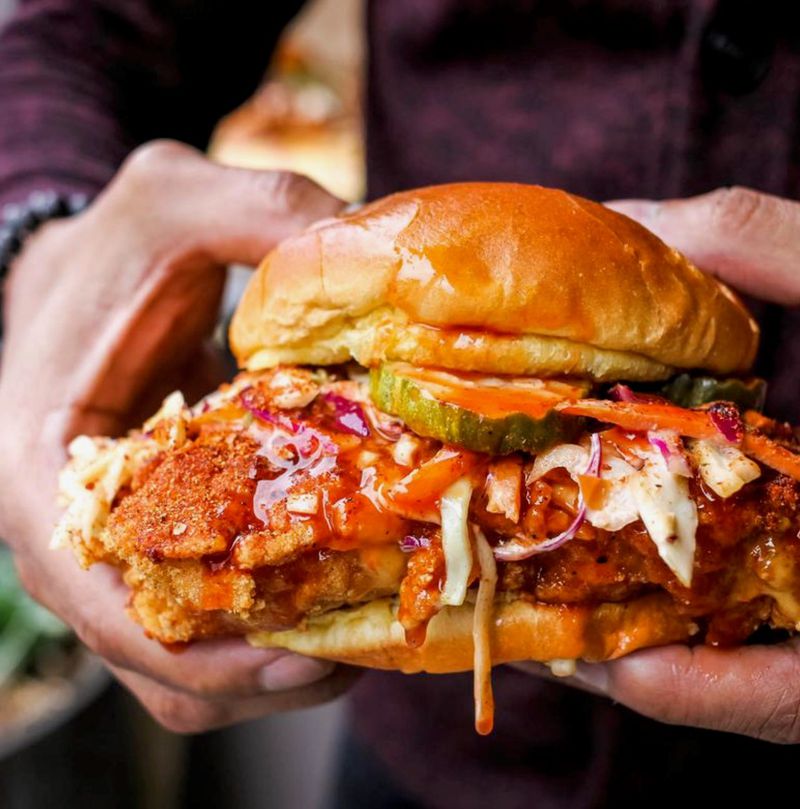 Scoville Hot Chicken basically serves one thing — the Nashville hot-chicken sandwich. The two-fisters are topped with creamy coleslaw, comeback sauce and pickles — and come at six different spice levels. Courtesy of Scoville Hot Chicken