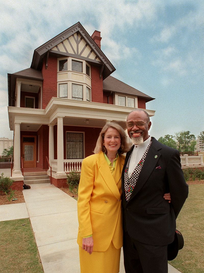 Mary Rose Taylor, former executive director of the Margaret Mitchell Foundation, and Dr. Otis Smith, recipient of a scholarship (tuition award) from Margaret Mitchell to attend Morehouse School of Medicine, stood in front of the newly renovated 'dump' in 1997. (AJC Staff Photo/Jean Shifrin)