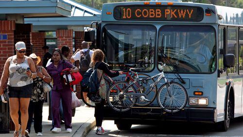 Pedestrians get off of a Cobb County Transit (CCT) bus at the Cumberland Blvd Tranfer Center across the street from the Cumberland Mall in Cobb County Thursday afternoon in Atlanta, Ga., May 12, 2011. Photo by Jason Getz / AJC Pedestrians get off of a Cobb County Transit (CCT) bus at the Cumberland Blvd Tranfer Center across the street from the Cumberland Mall in Cobb County Thursday afternoon in Atlanta, Ga., May 12, 2011. Photo by Jason Getz / AJC