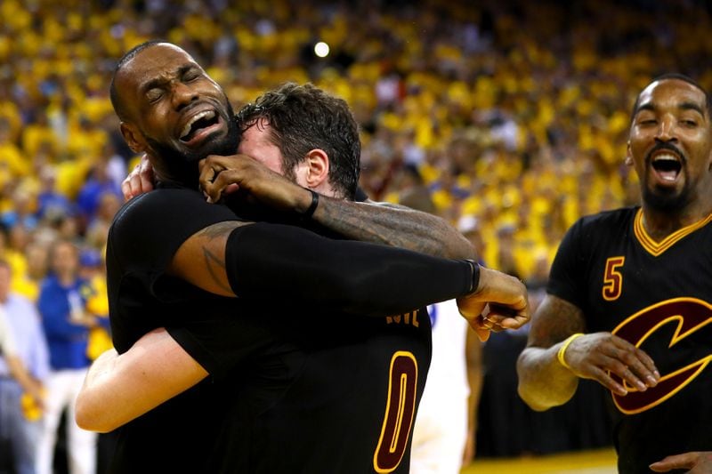 OAKLAND, CA - JUNE 19: LeBron James #23 and Kevin Love #0 of the Cleveland Cavaliers celebrate after defeating the Golden State Warriors 93-89 in Game 7 of the 2016 NBA Finals at ORACLE Arena on June 19, 2016 in Oakland, California. NOTE TO USER: User expressly acknowledges and agrees that, by downloading and or using this photograph, User is consenting to the terms and conditions of the Getty Images License Agreement. (Photo by Ezra Shaw/Getty Images)
