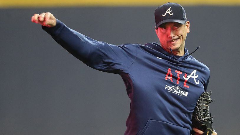 Braves veteran right-hander Charlie Morton, who will start Game 1 of the National League Division Series against the Brewers, keeps his arm loose during team practice at American Family Field on Thursday, Oct. 7, 2021, in Milwaukee.   “Curtis Compton / Curtis.Compton@ajc.com”