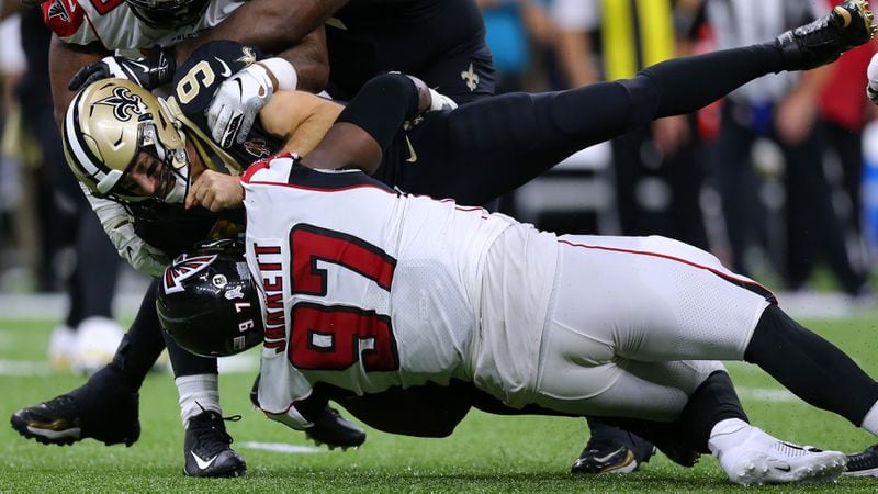 Falcons' Grady Jarrett takes down Saints quarterback Drew Brees during the second half of a game Nov. 10, 2019,  at the Mercedes Benz Superdome in New Orleans. The Falcons sacked Brees six times.