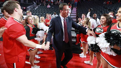 Georgia coach Tom Crean thanks the cheerleaders for their support and for firing up the crowd after a 84-51 victory over Kennesaw State on Tuesday, Nov. 27, 2018, in Athens. Curtis Compton/ccompton@ajc.com