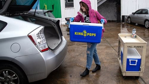 King of Pops Atlanta Territory Operations Manager Alice Diekhoff loads up the car she will use to make her home deliveries at their headquarters on March 23, 2020. King of Pops started home delivery last Wednesday as the coronavirus continued to ravage the state. STEVE SCHAEFER / SPECIAL TO THE AJC