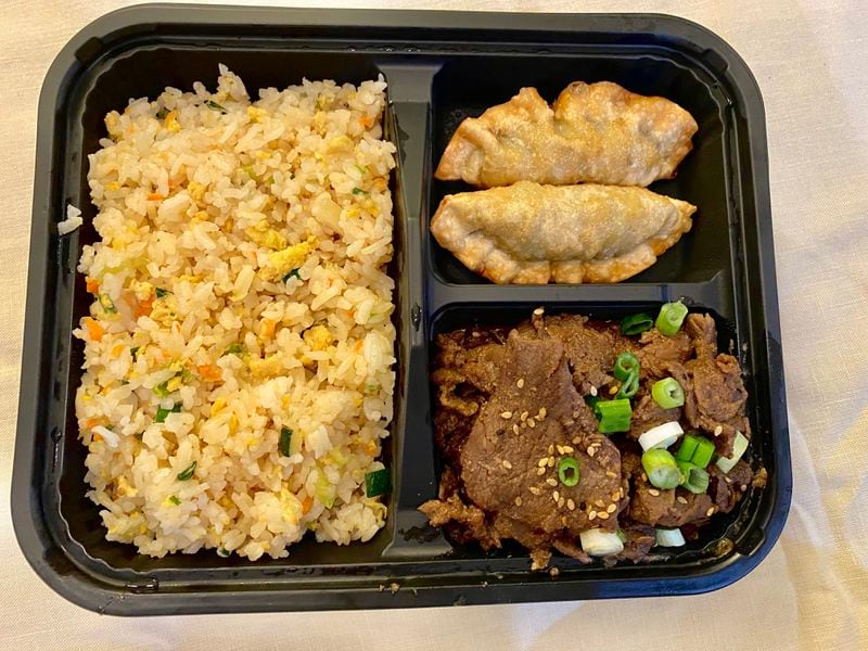 Let’s Bap offers numerous dosirak, or lunchbox, options. Pictured is one that features, clockwise from left, Korean fried rice, pork mandu (dumplings) and bulgogi (grilled beef). Ligaya Figueras/ligaya.figueras@ajc.com
