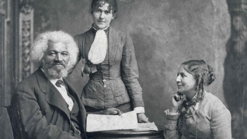 Frederick Douglass poses with Helen Pitts Douglass (seated, right). Helen's sister Eva Pitts stands in the center. (National Parks Service)