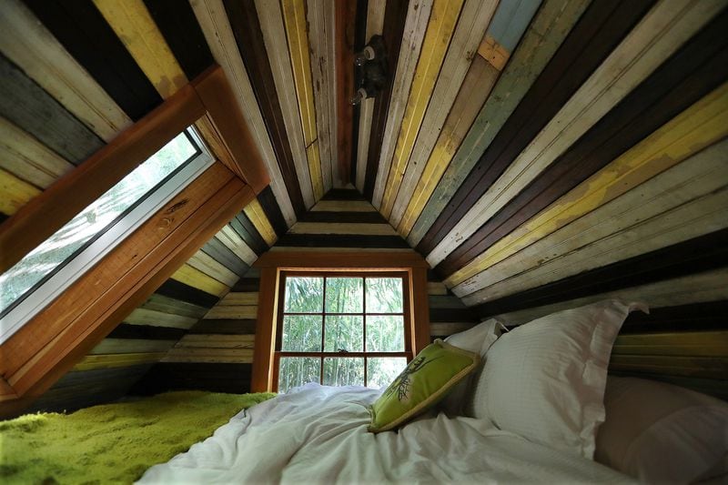 The sleeping loft inside the alpaca treehouse features multiple types of reclaimed wood. Curtis Compton/ccompton@ajc.com