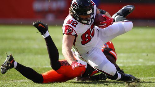 CLEVELAND, OH - NOVEMBER 11: Logan Paulsen #82 of the Atlanta Falcons hits the ground after being tackled by Derrick Kindred #26 of the Cleveland Browns in the first half at FirstEnergy Stadium on November 11, 2018 in Cleveland, Ohio. (Photo by Gregory Shamus/Getty Images)
