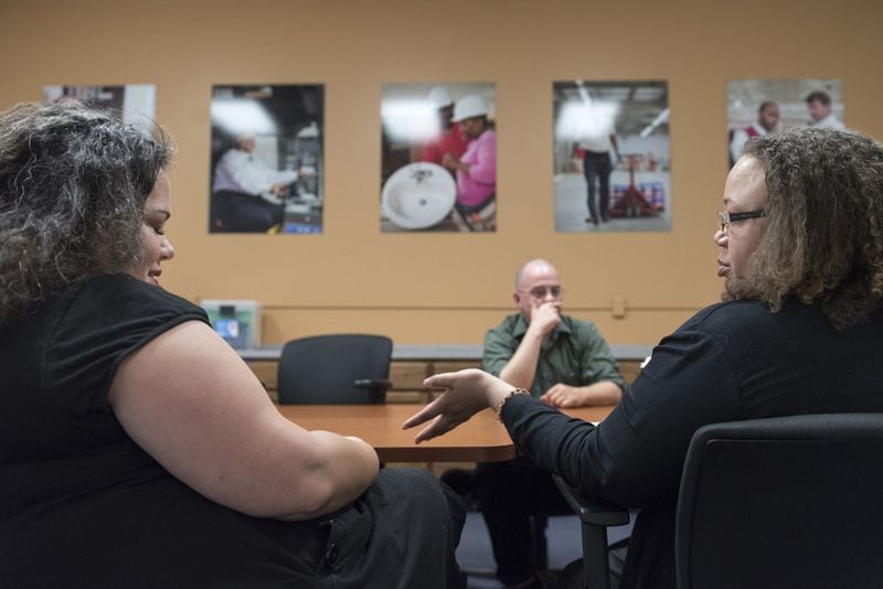 March 30, 2017, Oakwood - Tatrina Young, right, Food Stamp Training and Employment Coordinator, speaks with Jenny Taylor, left, Senior Director of Career Services, during a meeting in Oakwood, Georgia, on Thursday, March 30, 2017. The Goodwill of North Georgia’s career center offers training to many individuals who have a desire to work and are looking for a job in order to continue to receive SNAP benefits. (DAVID BARNES / DAVID.BARNES@AJC.COM)