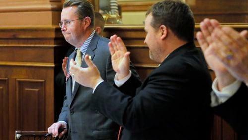 Rep. Kevin Tanner, R - Dawsonville, receives an ovation after the passage of HB 930, the mass transportation bill. BOB ANDRES /BANDRES@AJC.COM