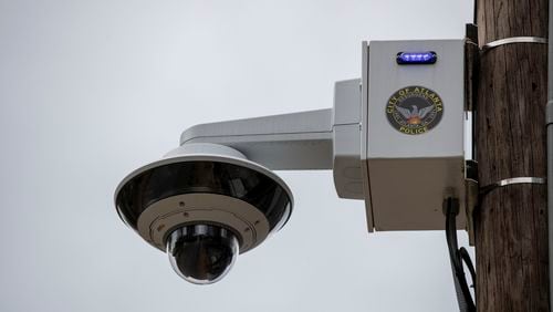 An Atlanta Police Department surveillance camera sits outside a mini-precinct at the intersection of Hardee Street and Mayson Avenue in Atlanta's Edgewood community.