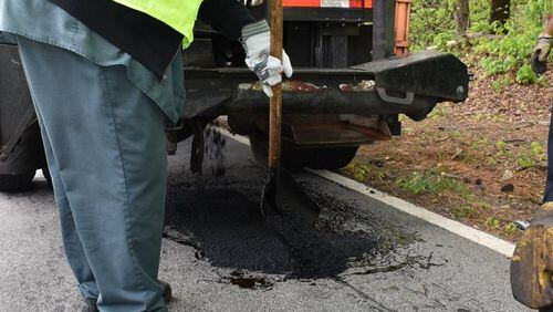 DeKalb County officials say the SPLOST Program will have provided 100 miles of paved roads by September. CONTRIBUTED