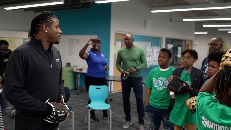 Former Major League pitcher Edwin Jackson tutors kids in the L.E.A.D. program. Jackson's Players Alliance recently donated $150,000 to the program