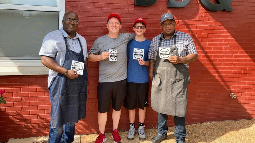 Equality Lives Here founder and NFA Burger Billy Kramer (second from left) with Lake & Oak BBQ owners Josh Lee (far left) and Todd Richards (far right). / Courtesy of Equality Lives Here