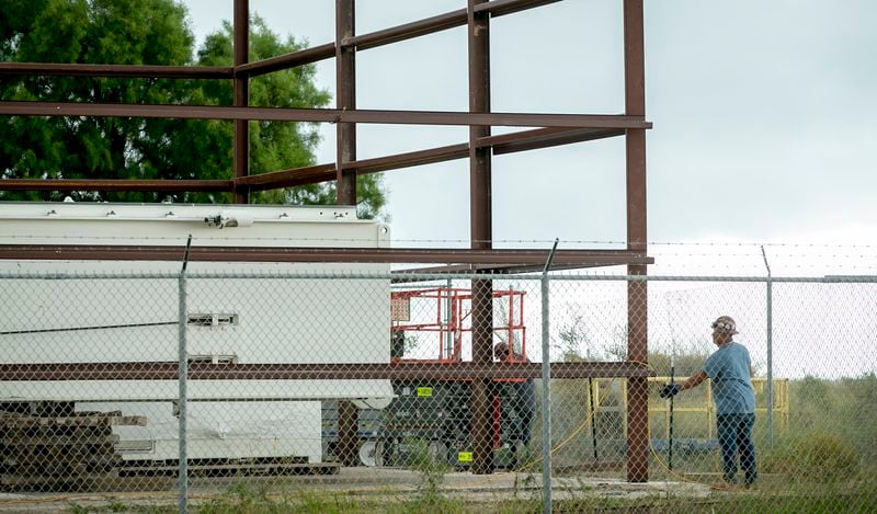 A worker frames a building at SpaceX in Boca Chica on Wednesday November 8, 2017.