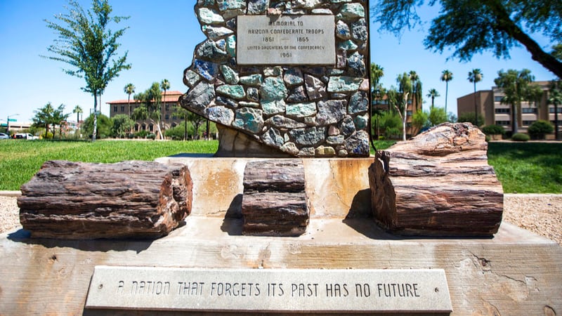 FILE - This June 5, 2017 file photo shows a monument to Arizona Confederate soldiers, presented by the United Daughters of the Confederacy in 1961, amid other memorials at Wesley Bolin Memorial Plaza on the grounds of the Capitol complex in Phoenix.