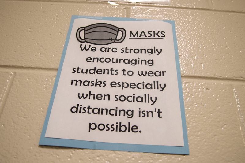 08/20/2020 - Cartersville, Georgia - A sign encouraging students to wear face coverings is displayed in the hallway at Cartersville Middle School in Cartersville, Thursday, August 20, 2020.  (ALYSSA POINTER / ALYSSA.POINTER@AJC.COM)