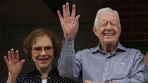 Former President Jimmy Carter and First Lady Rosalynn Carter wave to a beauty queen during the Peanut Festival on Saturday September 26, 2015 in Plains. The Carters are a major presence at the annual event, including the 2016 festival where they signed books, handed out road race awards and took in the parade. Ben Gray / bgray@ajc.com