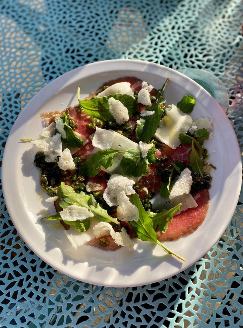One of Gigi’s signature starters is beef carpaccio with salsa verde, manchego, rice crackers, and arugula.
Wendell Brock for The Atlanta Journal-Constitution