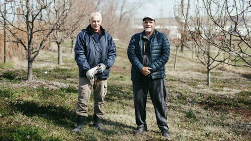 Calvin Hoover and Jim Jarsulic founders of Turner Community Garden in the garden’s orchard in Kansas City, Kansas. (Chase Castor/The Beacon)