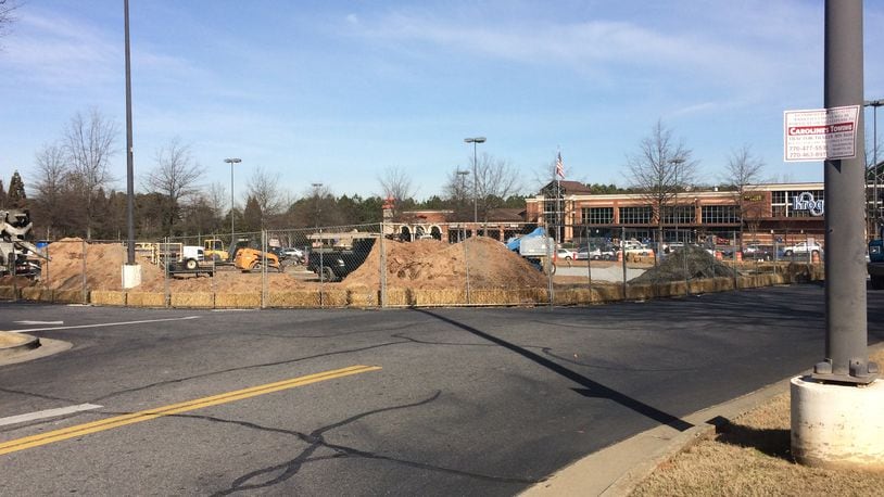 Readers are curious about what’s being built in the parking lot in front of the Kroger on Holcomb Bridge Road.